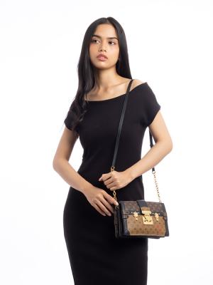 Reverse Monogram Trunk Clutch